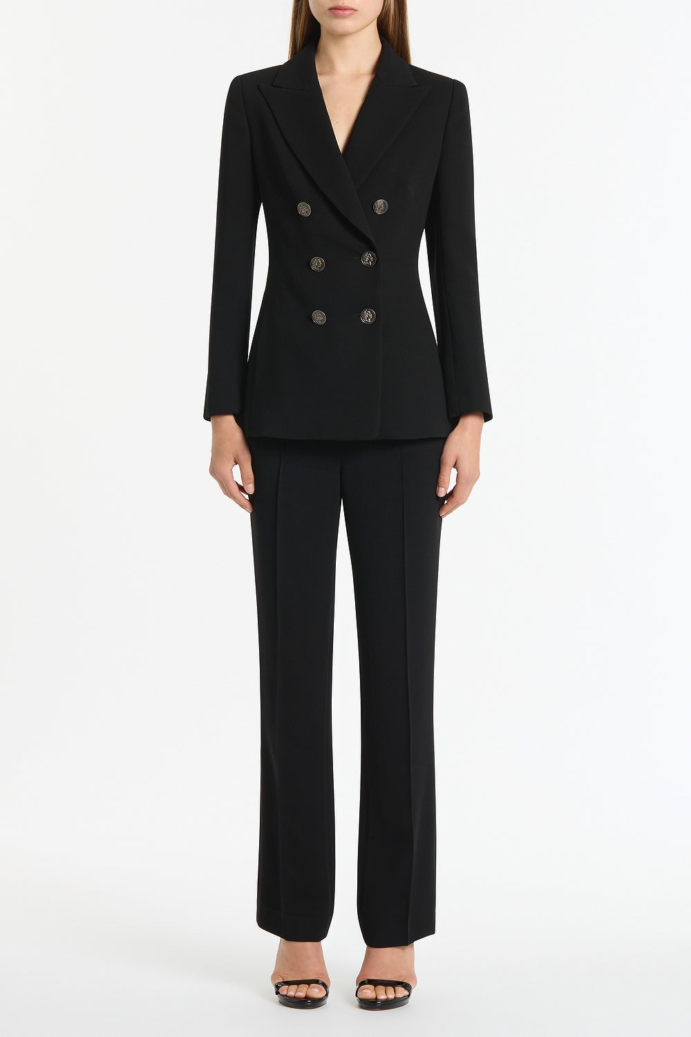 Image of a model wearing Pants. Product name - Black Crepe Cigarette Pant in Black colour by brand - Carla Zampatti