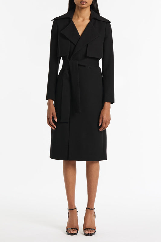 Image of a model wearing Outerwear. Product name - Black Crepe Double-Breasted Trench Coat in Black colour by brand - Carla Zampatti