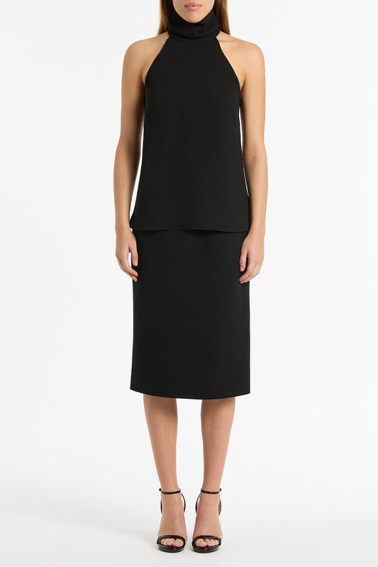 Image of a model wearing Tops. Product name - Black Crepe Halter Top in Black colour by brand - Carla Zampatti
