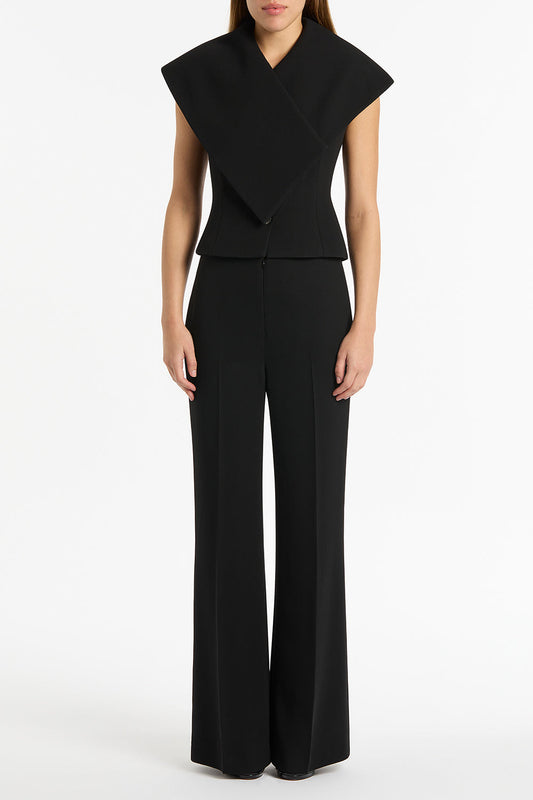 Image of a model wearing Pants. Product name - Black Crepe Low Waist Pant in Black colour by brand - Carla Zampatti