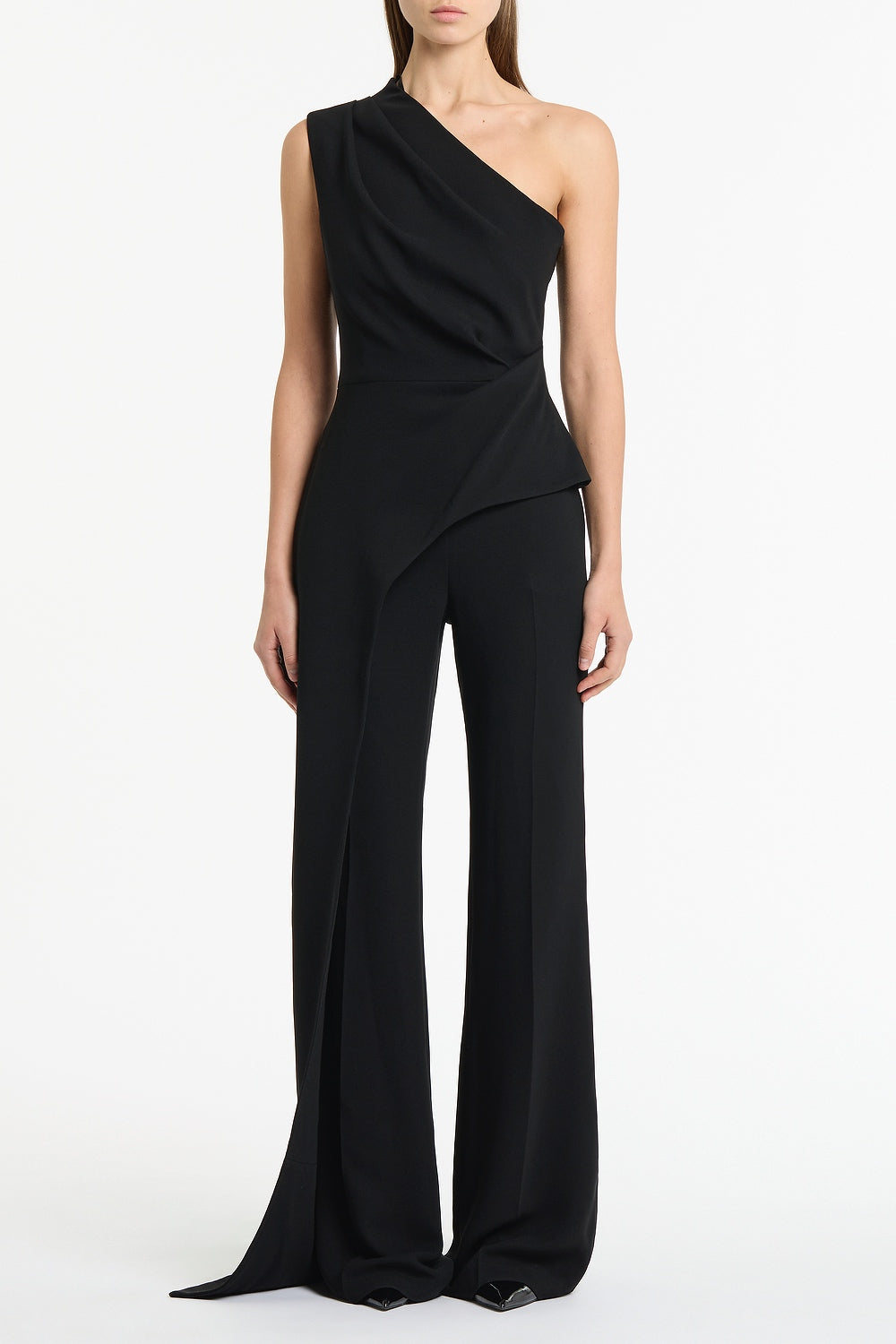 Image of a model wearing Tops. Product name - Black Crepe One Shoulder Longline Top in Black colour by brand - Carla Zampatti
