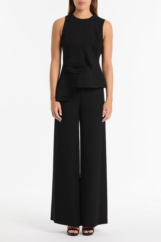 Image of a model wearing Tops. Product name - Black Crepe Petal Detail Top in Black colour by brand - Carla Zampatti
