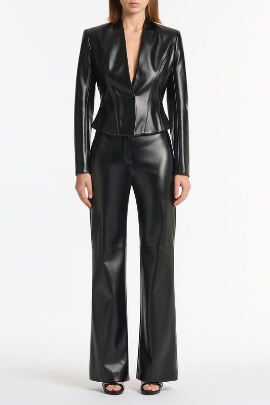 Image of a model wearing Pants. Product name - Black Faux Leather Wide Leg Pant in Black colour by brand - Carla Zampatti