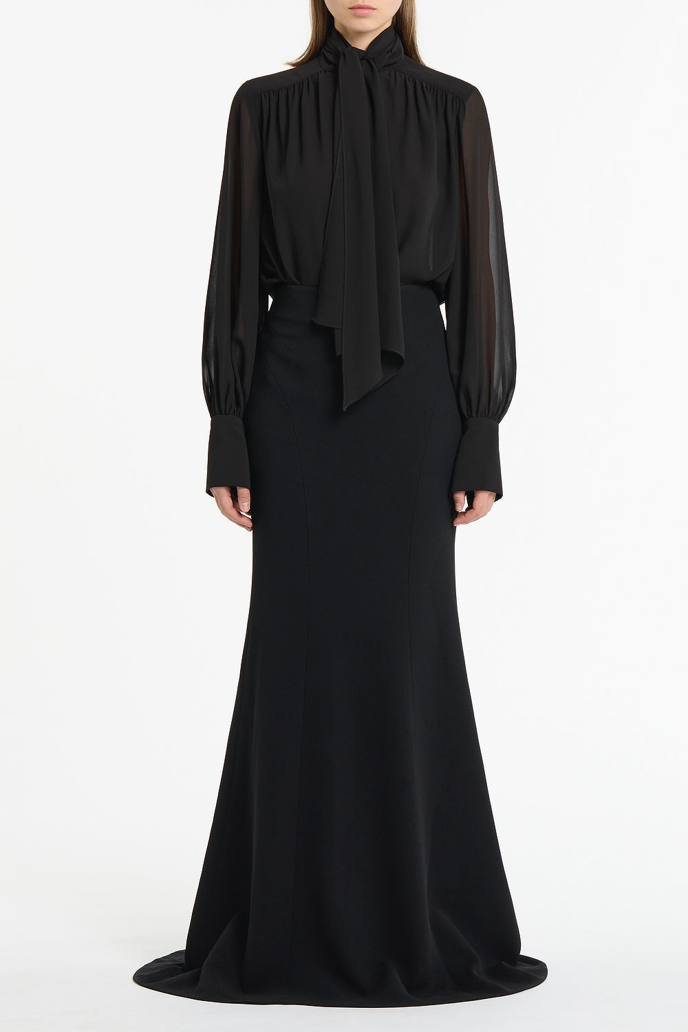 Image of a model wearing Tops. Product name - Black Georgette Bow Front Blouse in Black colour by brand - Carla Zampatti