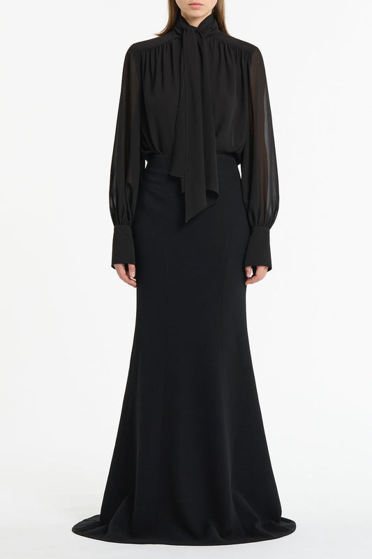 Image of a model wearing Tops. Product name - Black Georgette Bow Front Blouse in Black colour by brand - Carla Zampatti