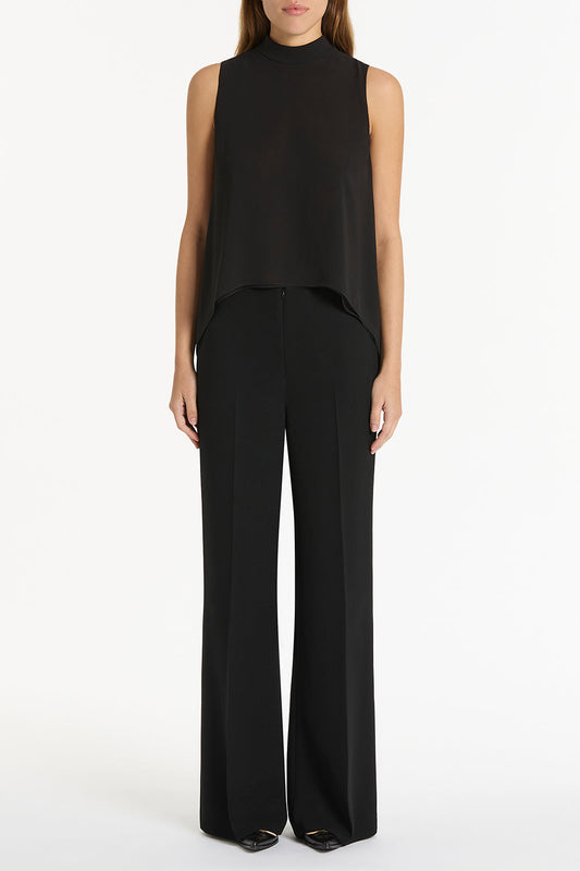 Image of a model wearing Tops. Product name - Black Georgette Fluted Tunic in Black colour by brand - Carla Zampatti