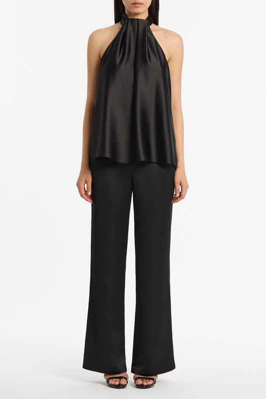 Image of a model wearing Tops. Product name - Black Lustre Satin Drape Neck Top in Black colour by brand - Carla Zampatti