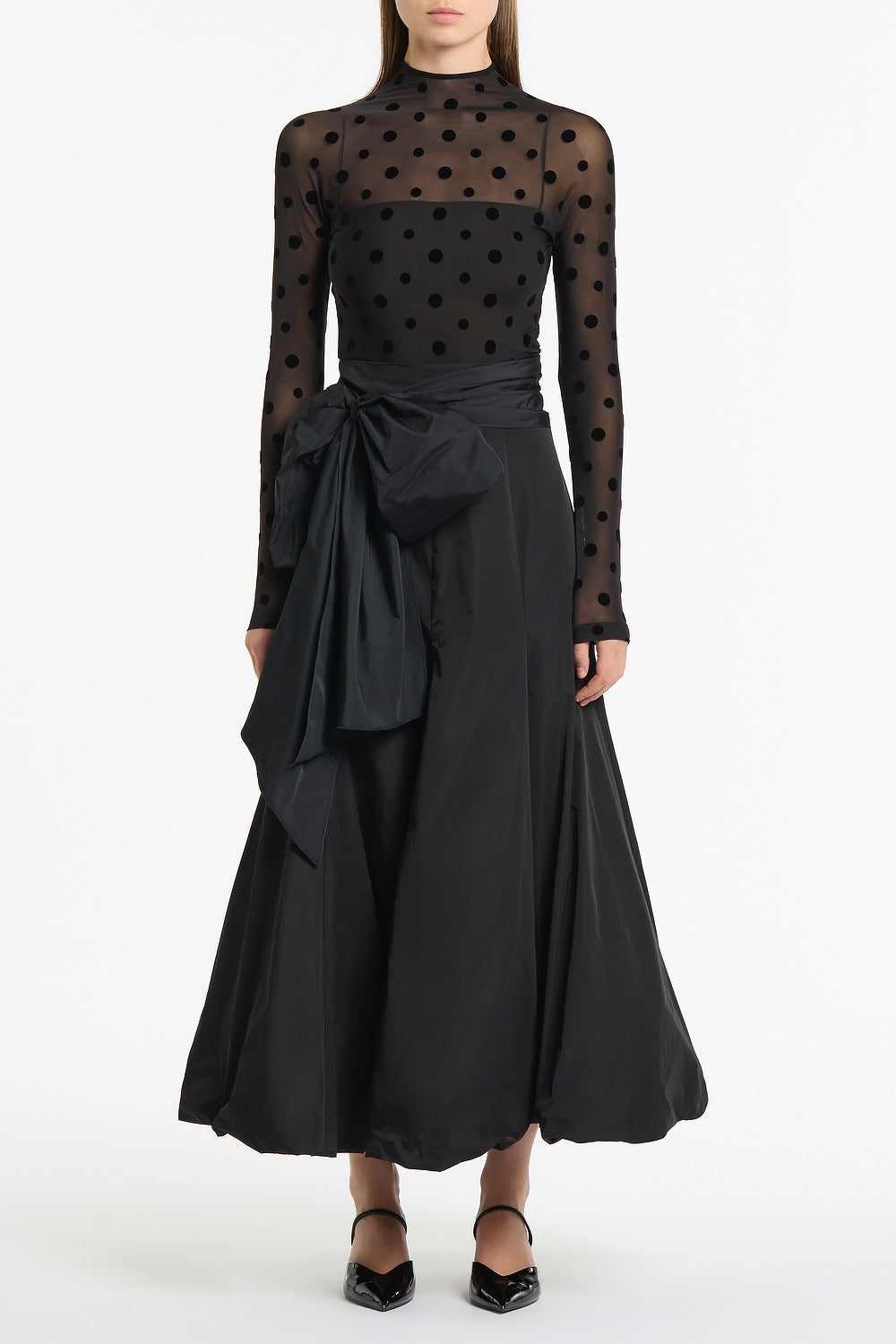 Image of a model wearing Tops. Product name - Black Mesh Spot Long Sleeve Top in Black colour by brand - Carla Zampatti