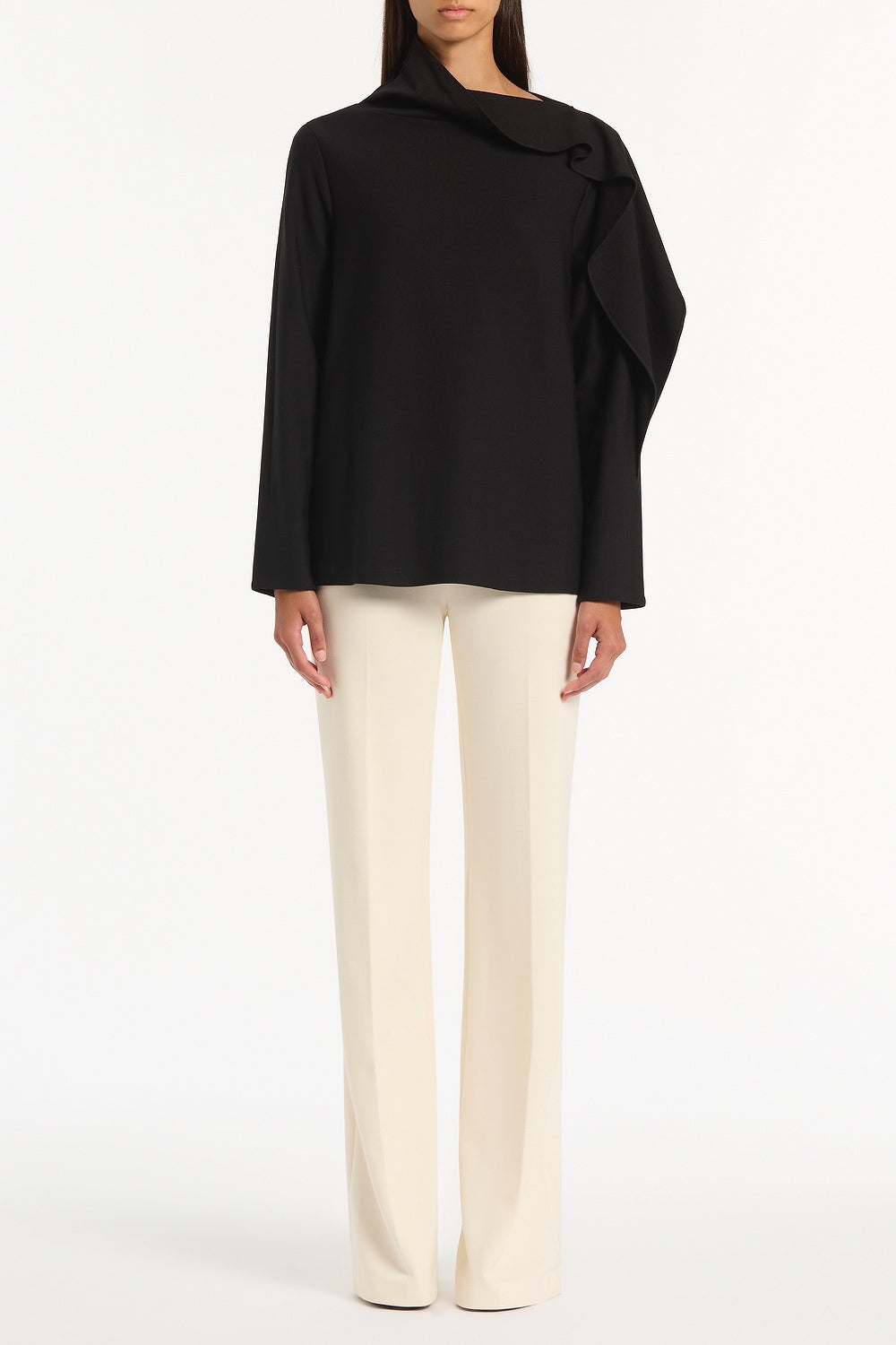 Image of a model wearing Tops. Product name - Black Ponte Shoulder Detail Top in Black colour by brand - Carla Zampatti