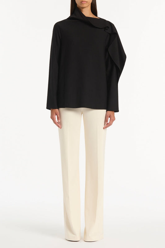 Image of a model wearing Tops. Product name - Black Ponte Shoulder Detail Top in Black colour by brand - Carla Zampatti
