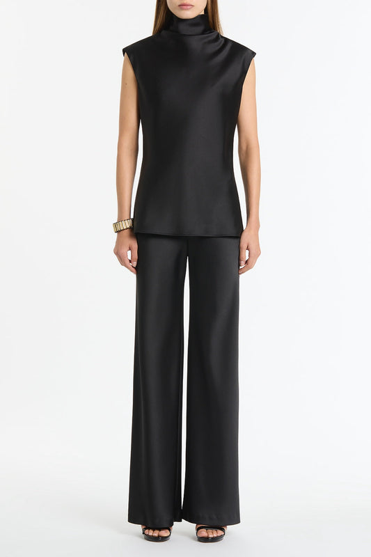 Image of a model wearing Tops. Product name - Black Satin Cap Sleeve Top in Black colour by brand - Carla Zampatti