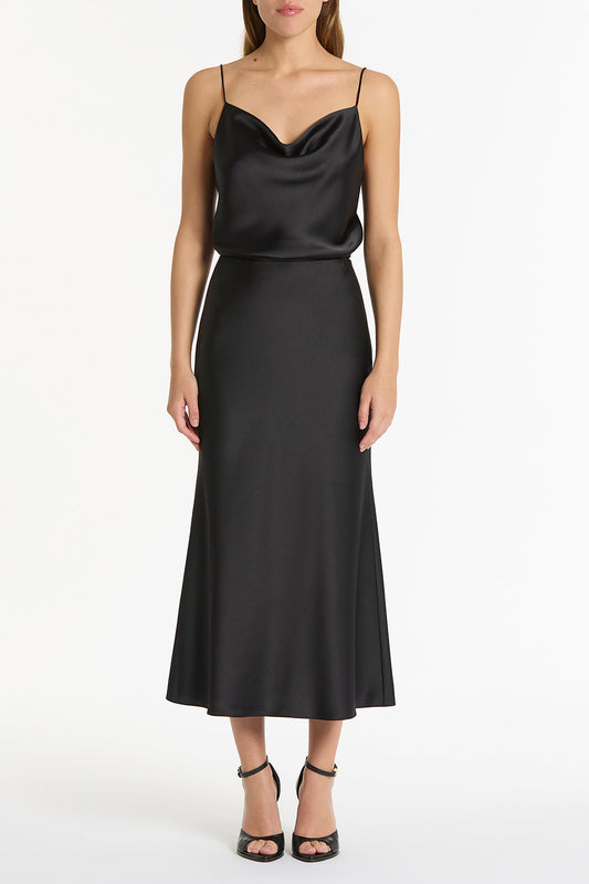 Image of a model wearing Skirts. Product name - Black Satin Midi Skirt in Black colour by brand - Carla Zampatti