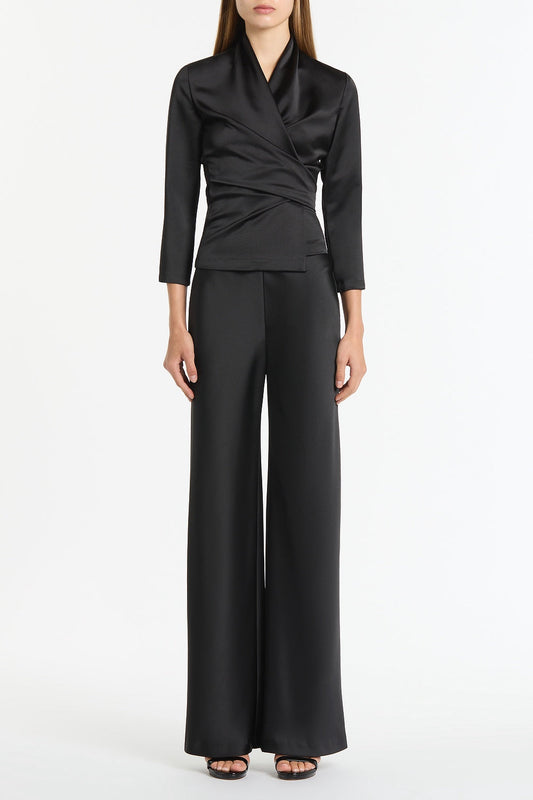 Image of a model wearing Tops. Product name - Black Satin Wrap Top in Black colour by brand - Carla Zampatti