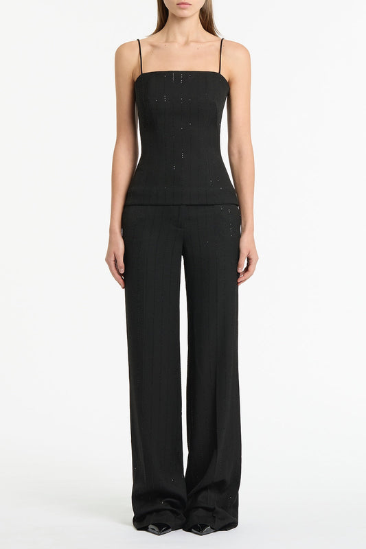Image of a model wearing Tops. Product name - Black Starlight Twill Bustier Top in Black colour by brand - Carla Zampatti