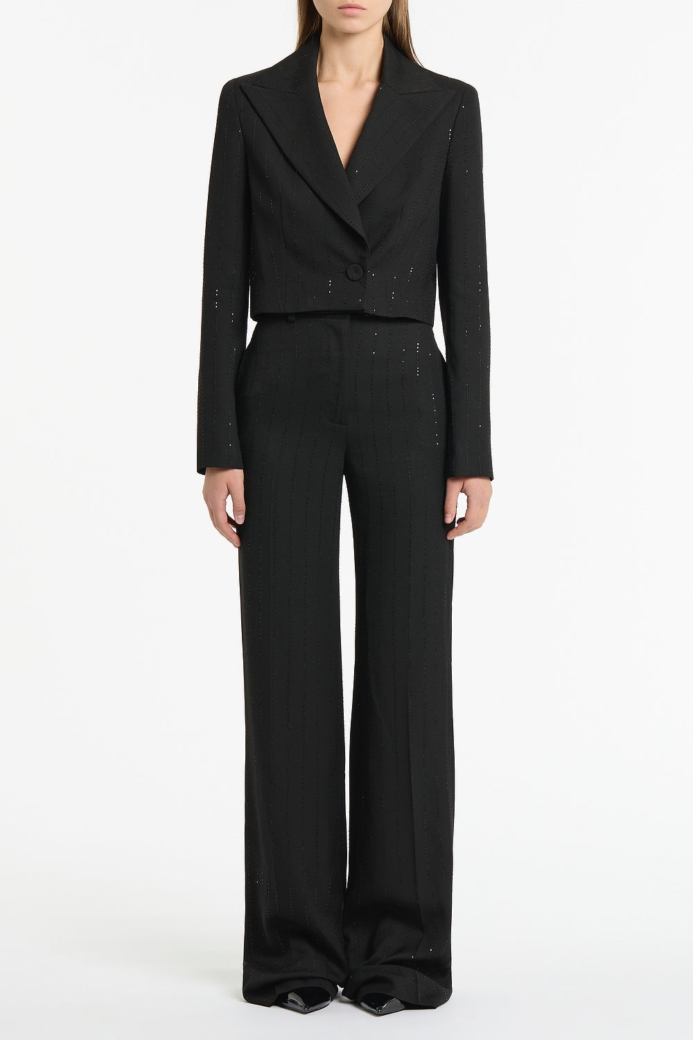 Image of a model wearing Pants. Product name - Black Starlight Twill Wide Leg Pant in Black colour by brand - Carla Zampatti
