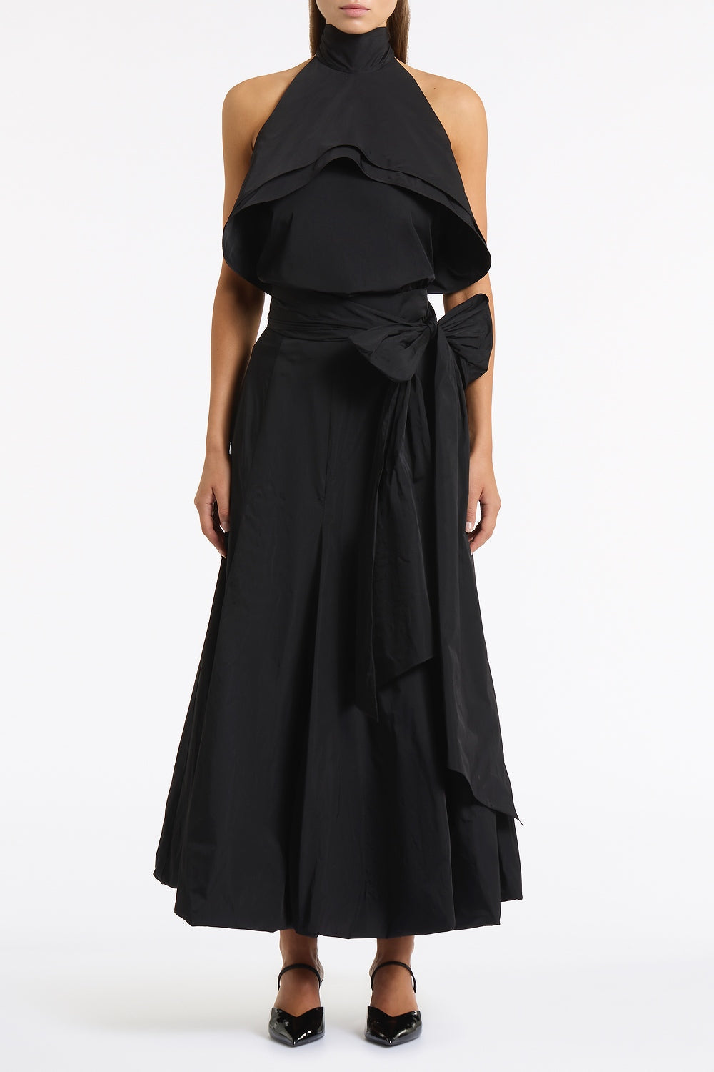 Image of a model wearing Tops. Product name - Black Taffeta Ruffle Bow Detail Top in Black colour by brand - Carla Zampatti