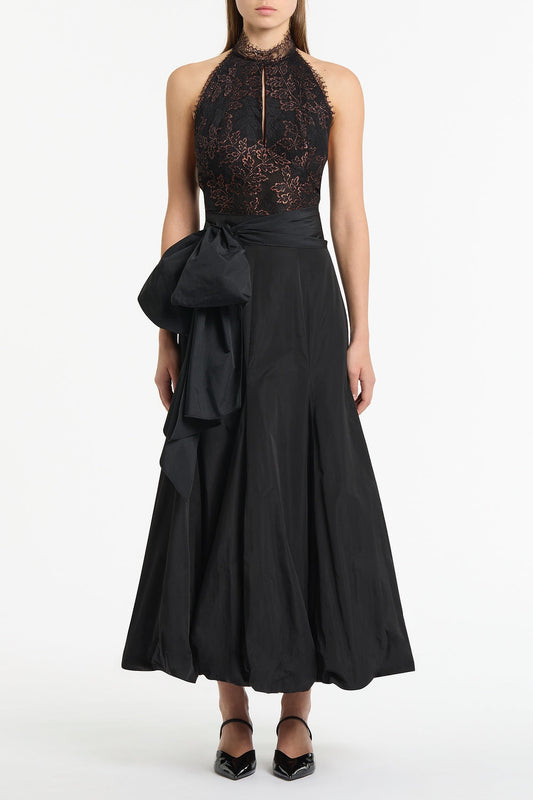 Image of a model wearing Skirts. Product name - Black Taffeta Tie Waist Bubble Skirt in Black colour by brand - Carla Zampatti