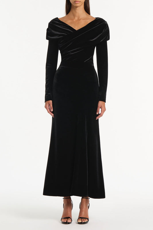 Image of a model wearing Tops. Product name - Black Velvet Draped Shoulder Top in Black colour by brand - Carla Zampatti
