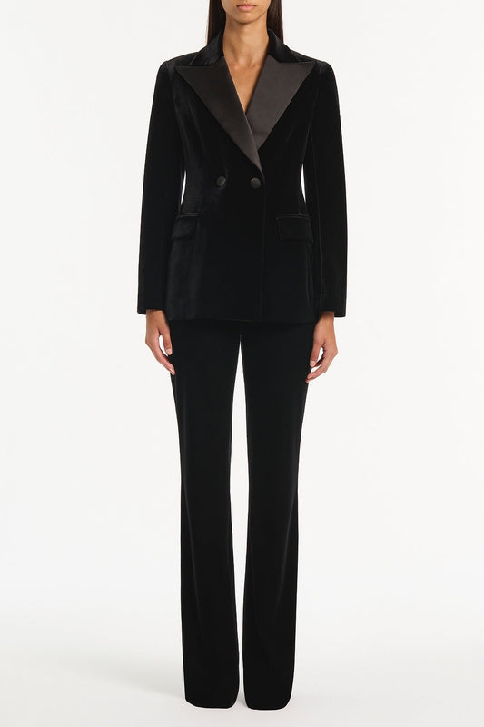 Image of a model wearing Pants. Product name - Black Velvet Pant in Black colour by brand - Carla Zampatti