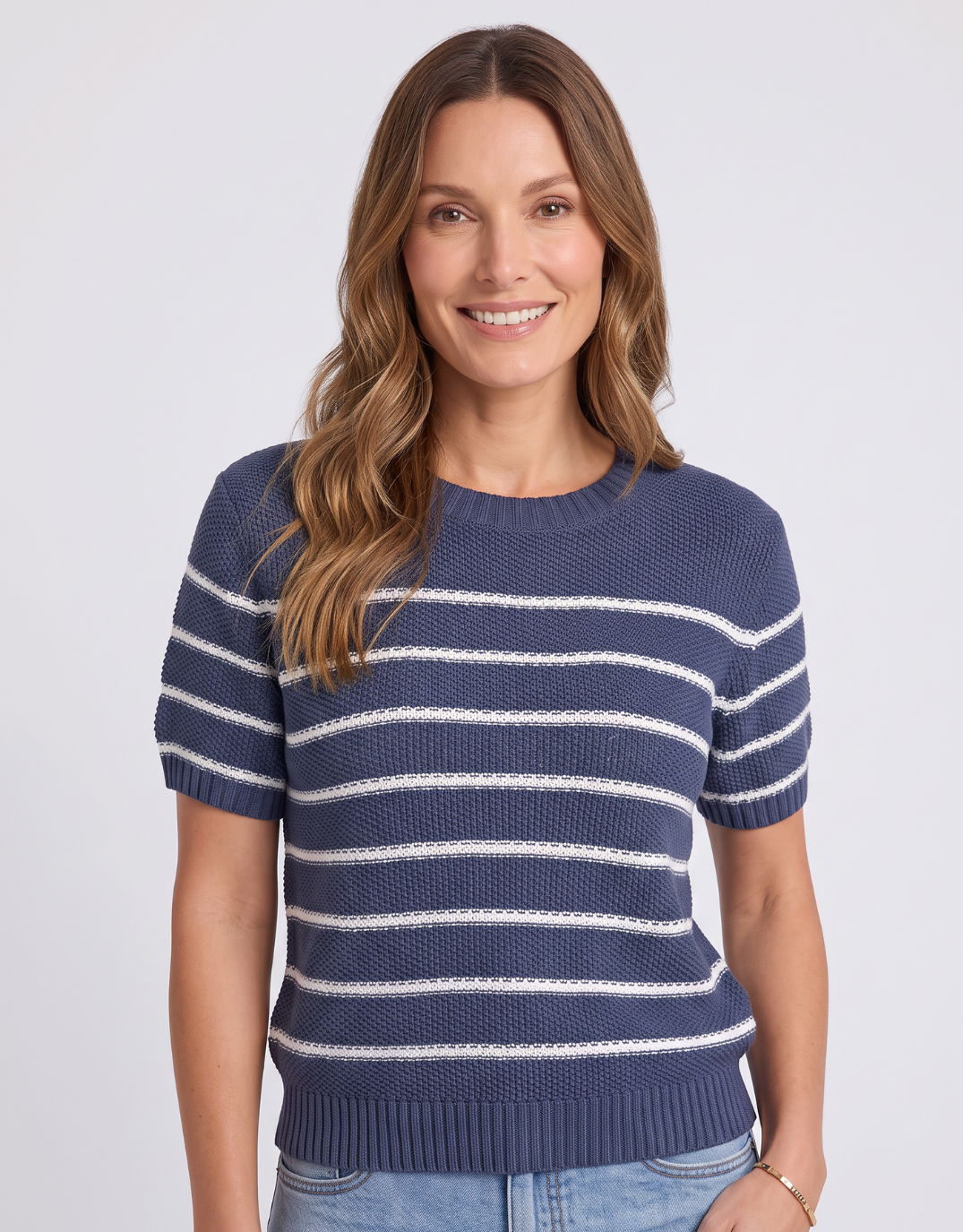 Image of a model wearing Outerwear. Product name - Blair Stripe Short Sleeve Knit Navy in Navy colour by brand - Foxwood