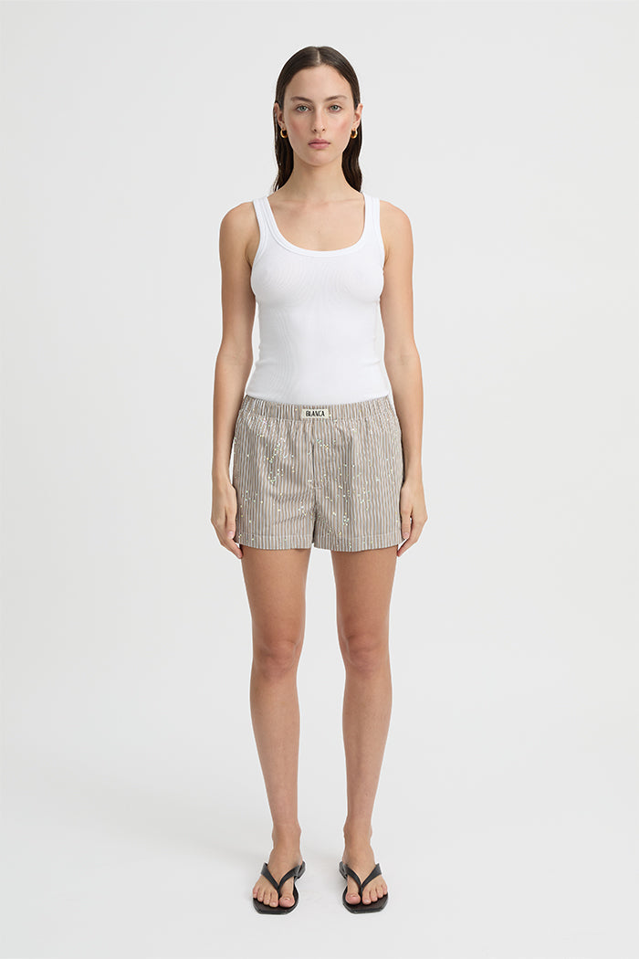 Image of a model wearing Shorts. Product name - Piper Shorts Taupe in Taupe colour by brand - Blanca Studio