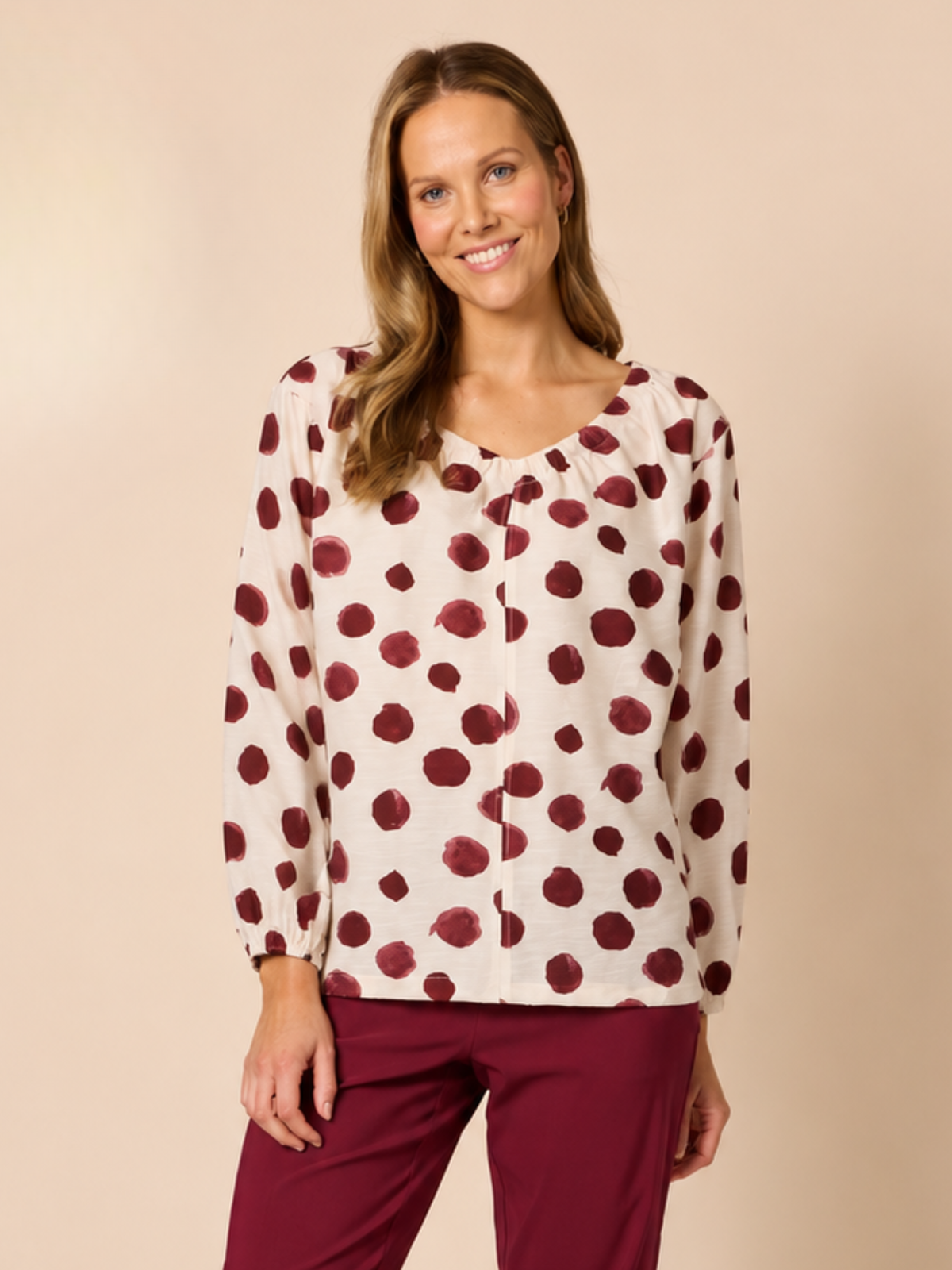 Image of a model wearing Tops. Product name - Bordeaux Spot Top Shiraz Multi in Shiraz Multi colour by brand - Clarity