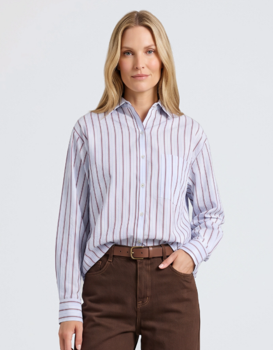 Image of a model wearing Tops. Product name - Breeze Shirt Blue in Blue colour by brand - Foxwood