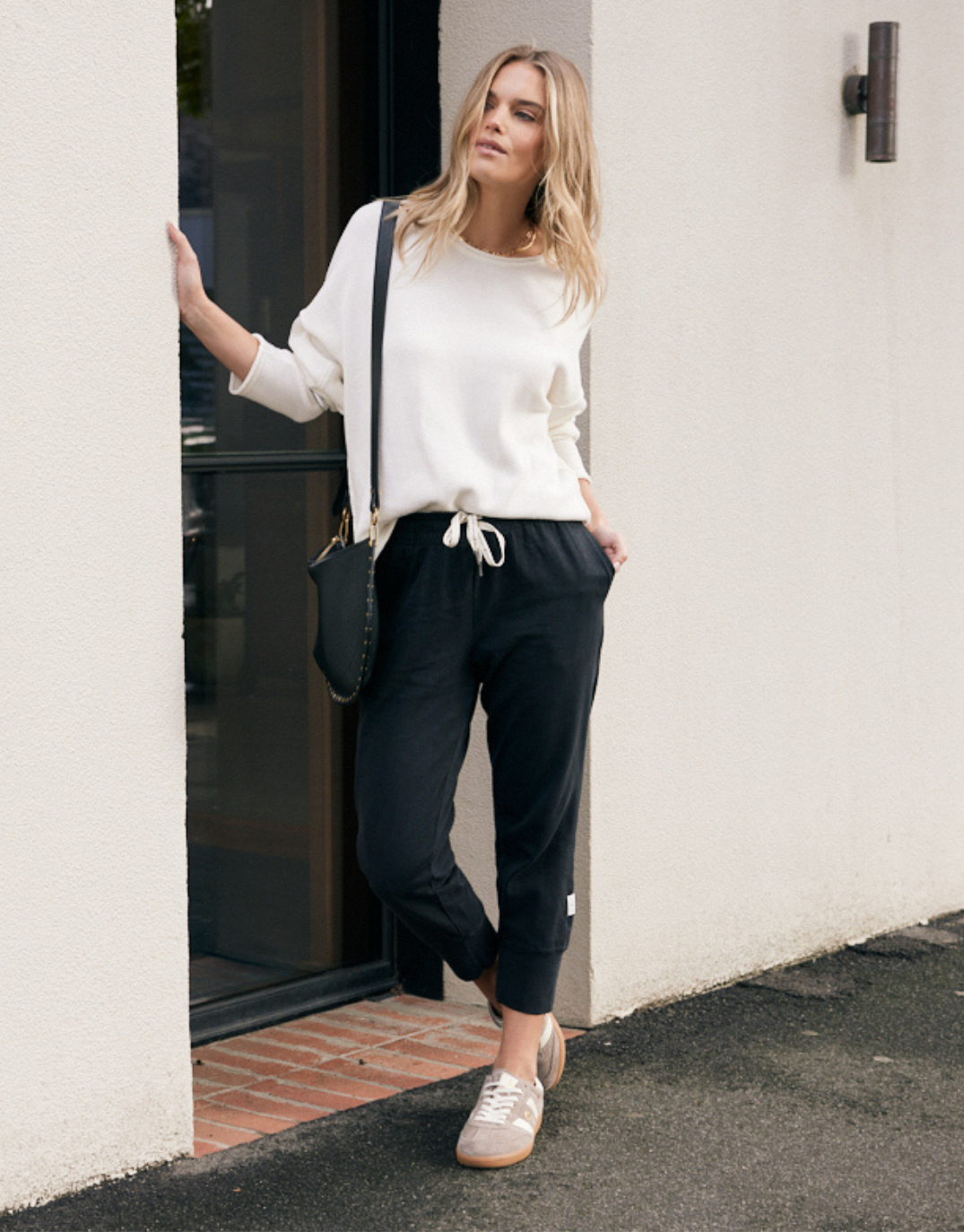 Image of a model wearing Pants. Product name - 3/4 Brunch Pants Black in Black colour by brand - Elm