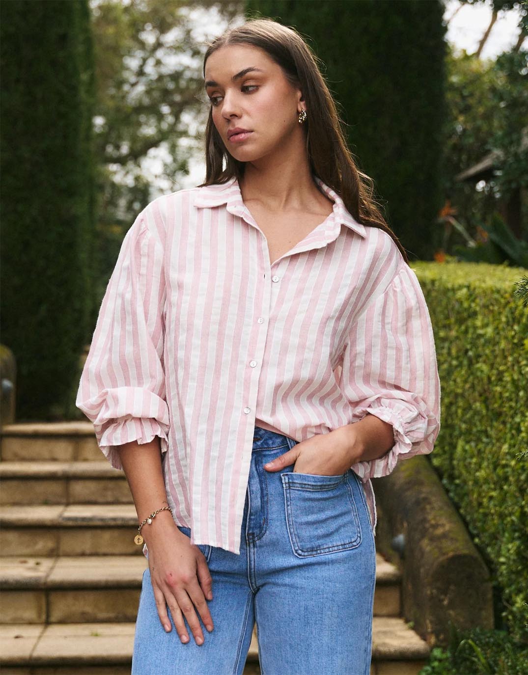 Image of a model wearing Tops. Productname: Connection Button Front Blouse - in Pink Stripe colour by brand - By Rosa