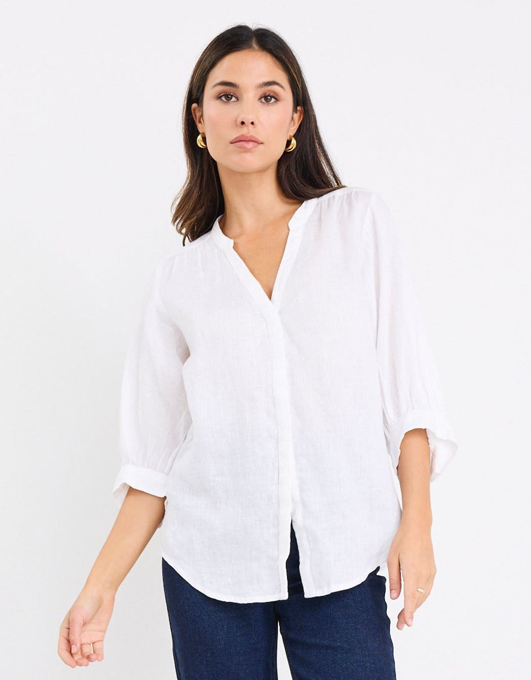 Image of a model wearing Tops. Productname: Deity Linen Button Through Puff Sleeve - in White colour by brand - By Rosa