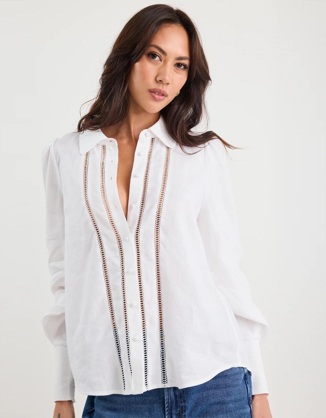 Image of a model wearing Tops. Product name - Zinnia Lace Trim Long Sleeve Shirt White in White colour by brand - By Rosa