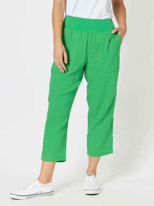 Image of a model wearing Pants. Product name - Byron Cotton 7/8 Pant Emerald in Emerald colour by brand - Threadz