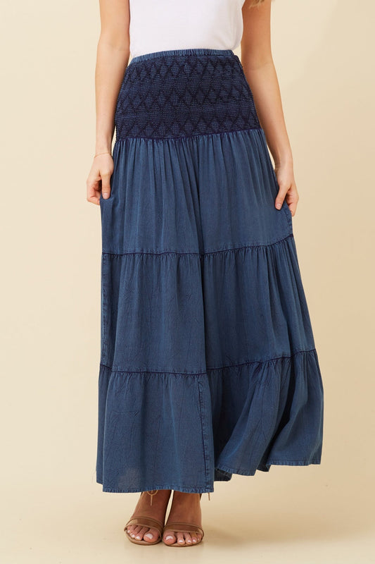 Image of a model wearing Skirts. Product name - KINGLEY TIERED MAXI SKIRT in Indigo colour by brand - Caroline Morgan Australia