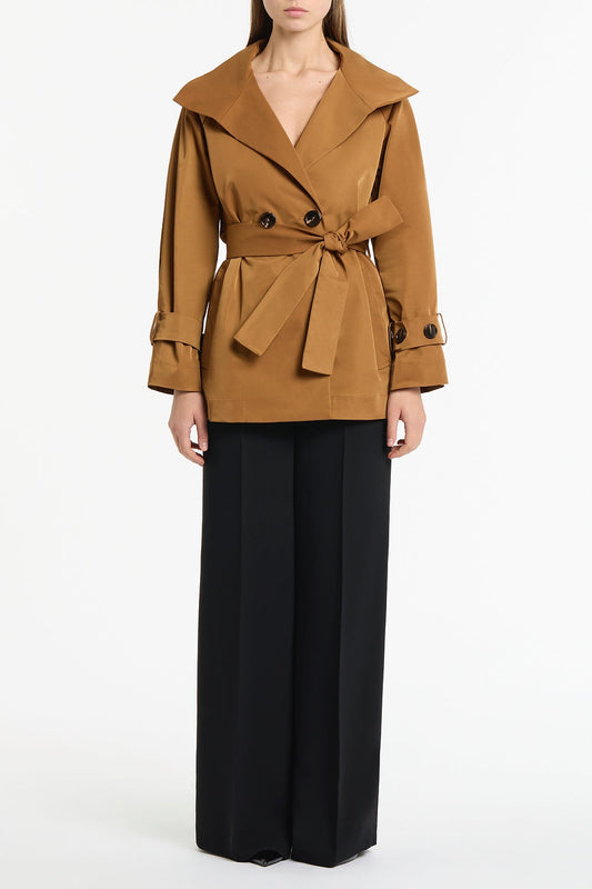 Image of a model wearing Shorts. Product name - Camel Taffeta Twill Short Trench Coat in Brown colour by brand - Carla Zampatti