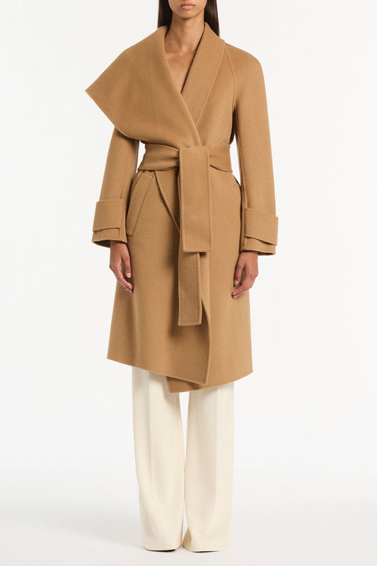 Image of a model wearing Outerwear. Product name - Camel Wool Drape Front Coat in Brown colour by brand - Carla Zampatti