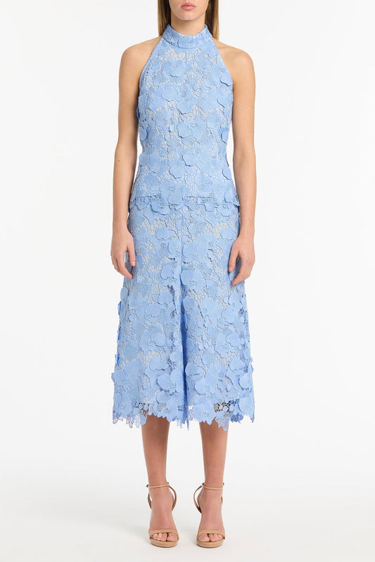 Image of a model wearing Tops. Product name - Celeste 3D Lace Halter Top in Blue colour by brand - Carla Zampatti