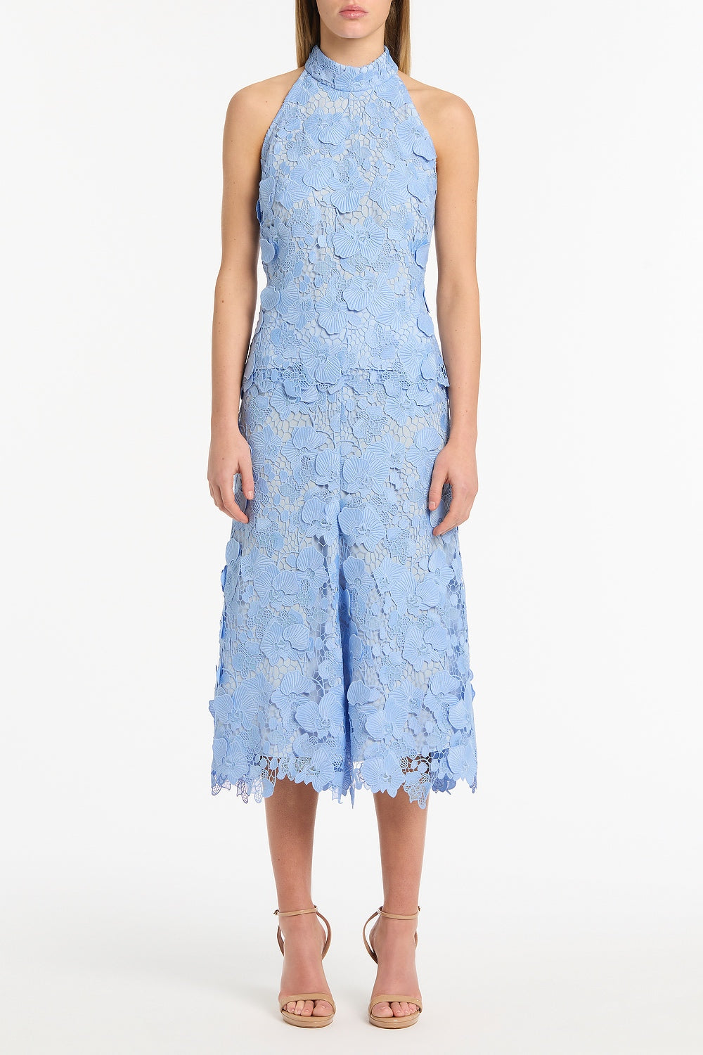 Image of a model wearing Skirts. Product name - Celeste 3D Lace Midi Skirt in Blue colour by brand - Carla Zampatti