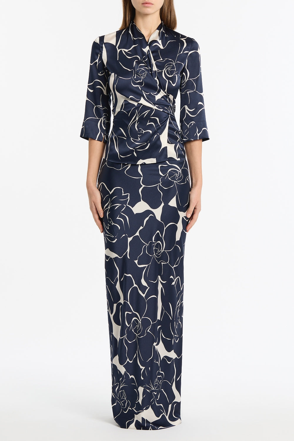 Image of a model wearing Tops. Product name - Celestial Petals Silk Viscose Wrap Top in Navy colour by brand - Carla Zampatti