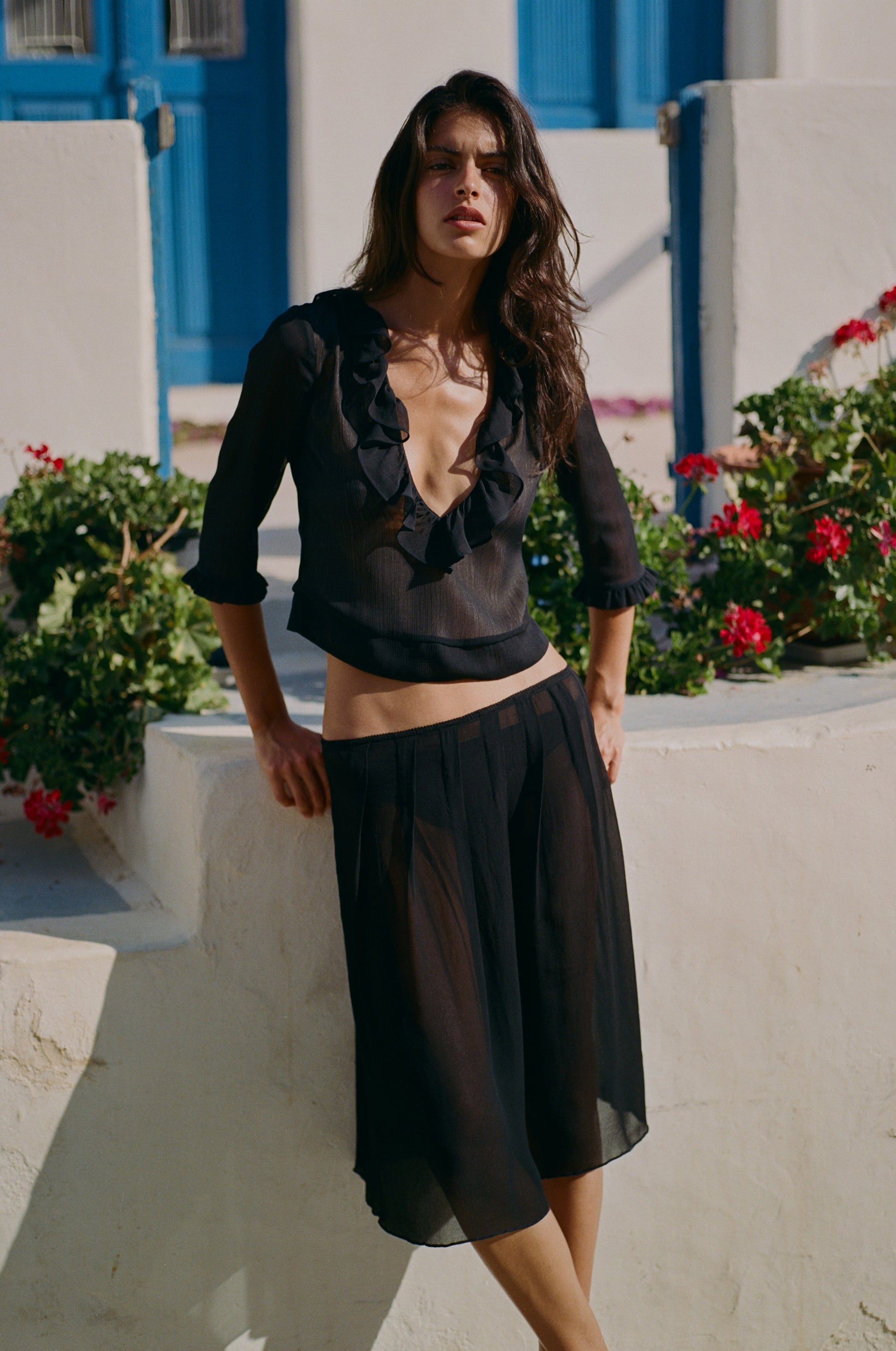 Image of a model wearing Skirts. Product name - Celia Skirt in Black colour by brand - With Jéan