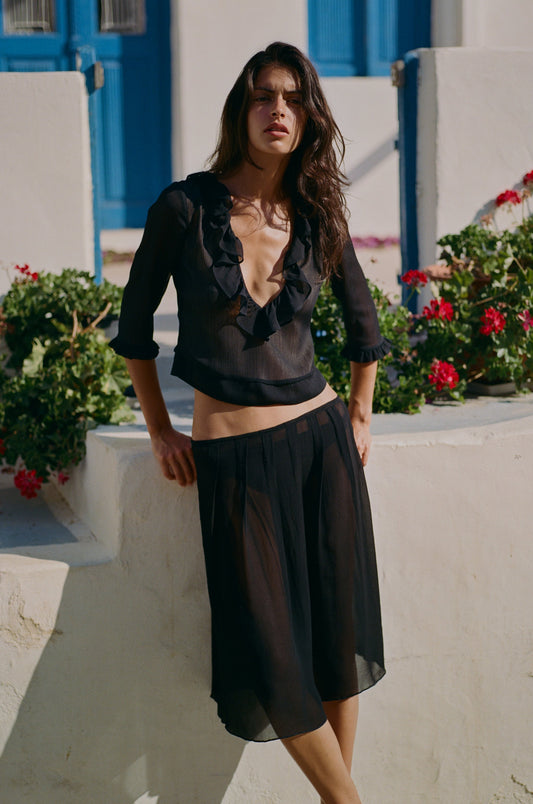 Image of a model wearing Skirts. Product name - Celia Skirt in Black colour by brand - With Jéan