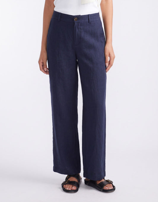 Image of a model wearing Pants. Product name - Chicago Linen Pant Navy in Navy colour by brand - White & Co.