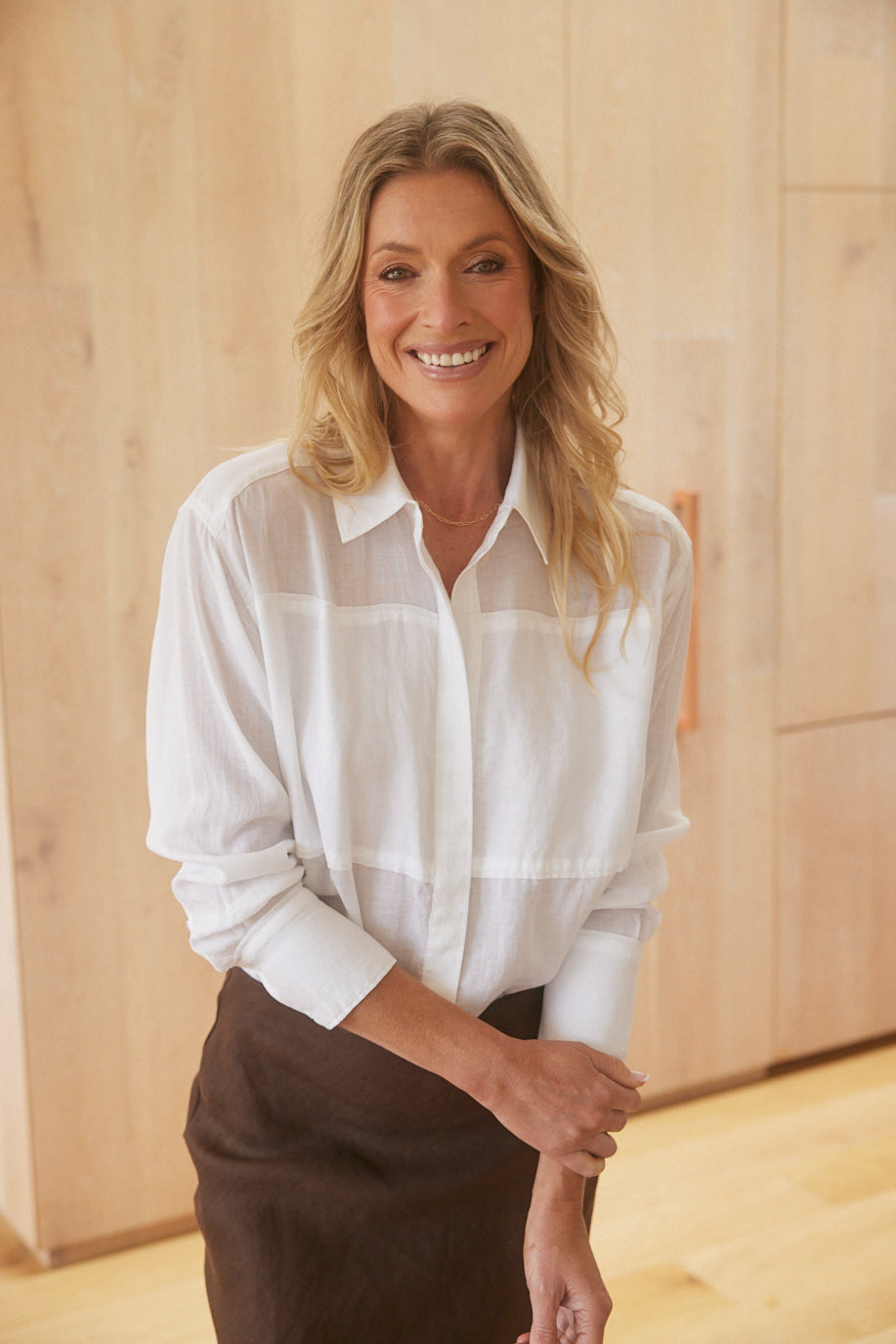 Image of a model wearing Tops. Product name - Chloe Panel Shirt White in White colour by brand - White & Co.