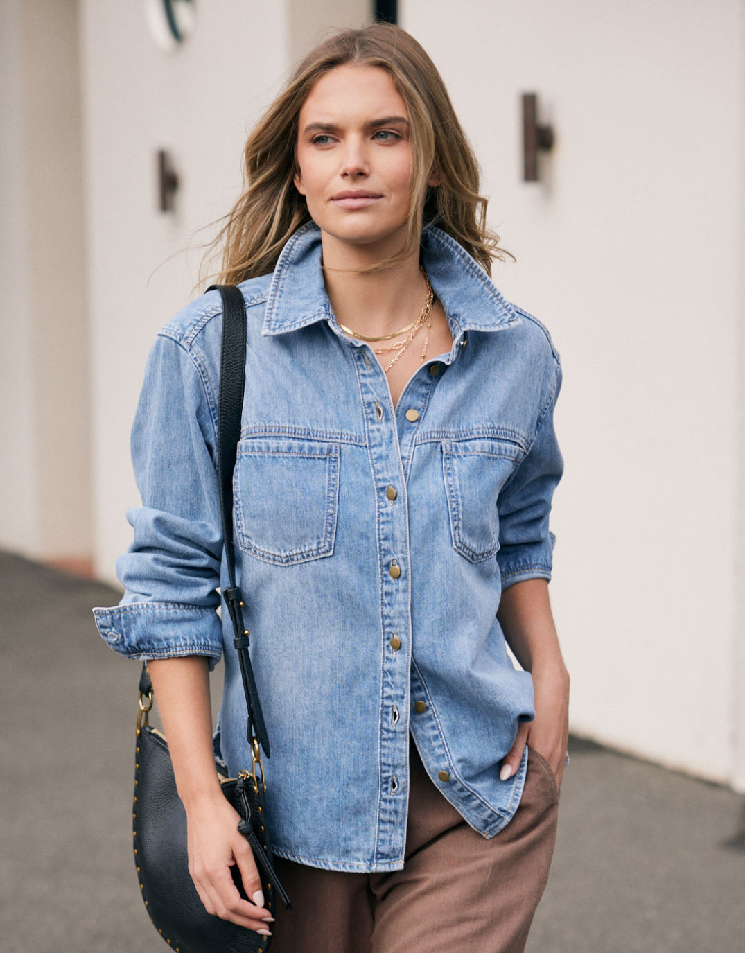 Image of a model wearing Tops. Product name - Claudia Relaxed Shirt Mid Wash in Mid Wash colour by brand - White & Co.