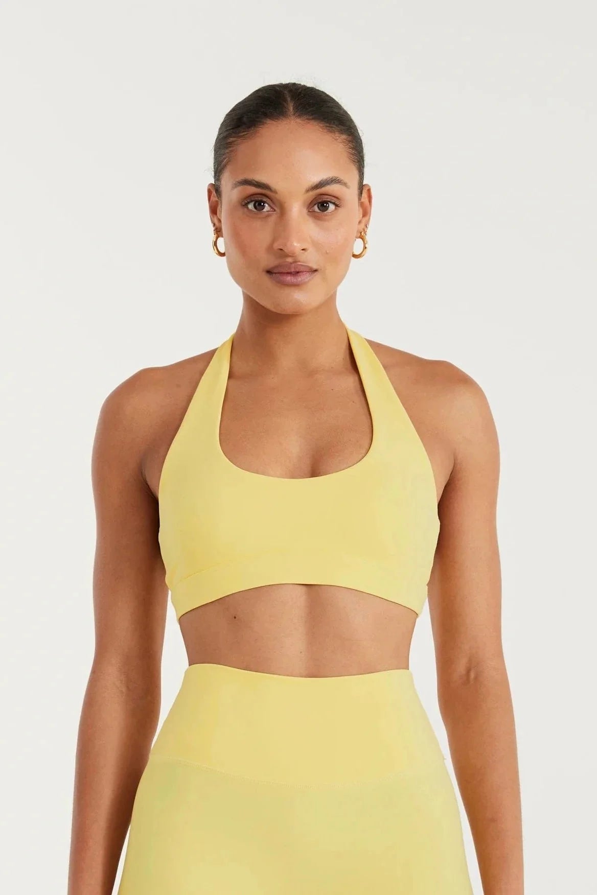 Image of Activewear. Product name - ALLFENIX CloudCore Halter Sports Bra in Yellow colour by brand - All Fenix