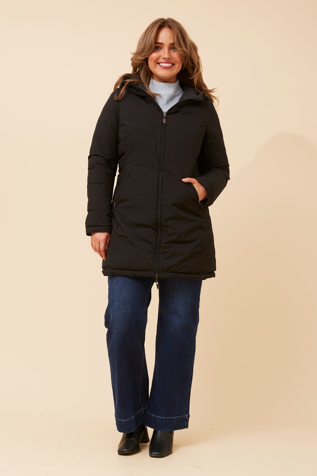 Image of a model wearing Outerwear. Product name - RONY REVERSIBLE PUFFER COAT in Black colour by brand - Stella