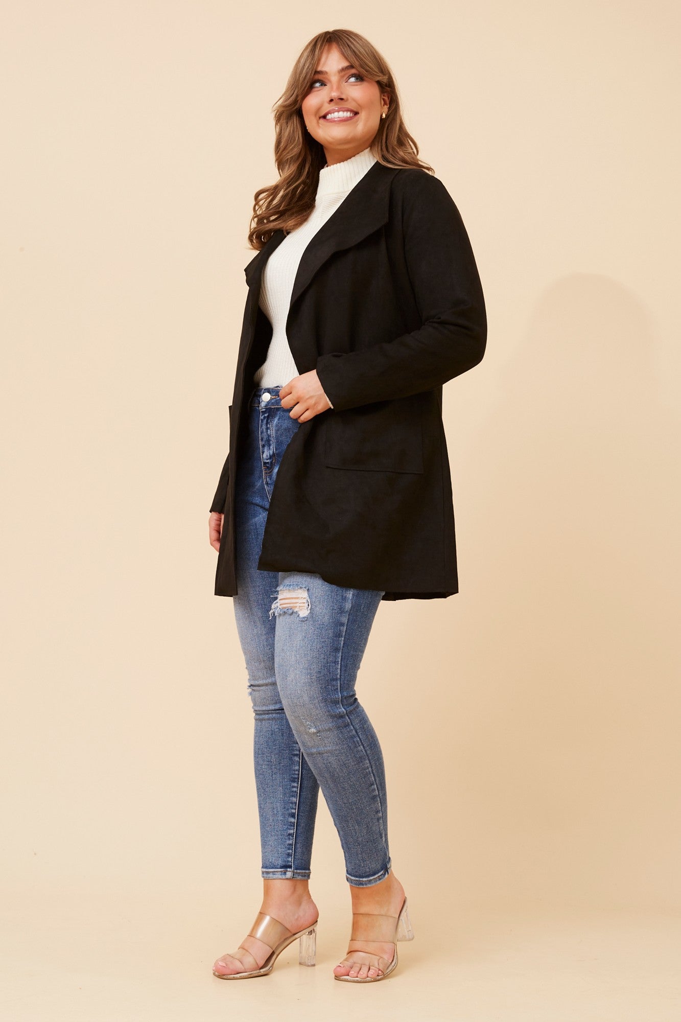 Image of a model wearing Outerwear. Product name - JOSIE FAUX SUEDE COAT in Black colour by brand - Caroline Morgan Australia