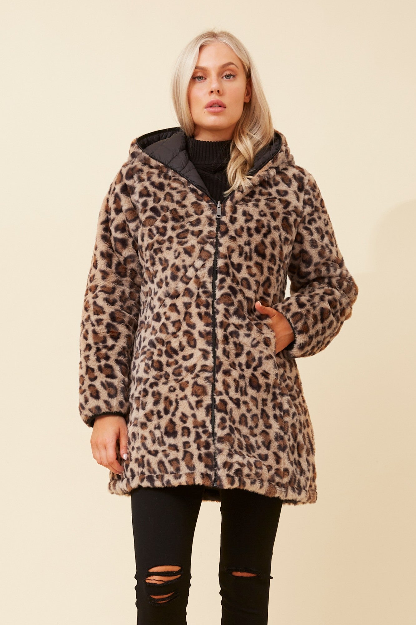 Image of a model wearing Outerwear. Product name - CONGO REVERSIBLE PUFFER COAT in Black colour by brand - Caroline Morgan Australia