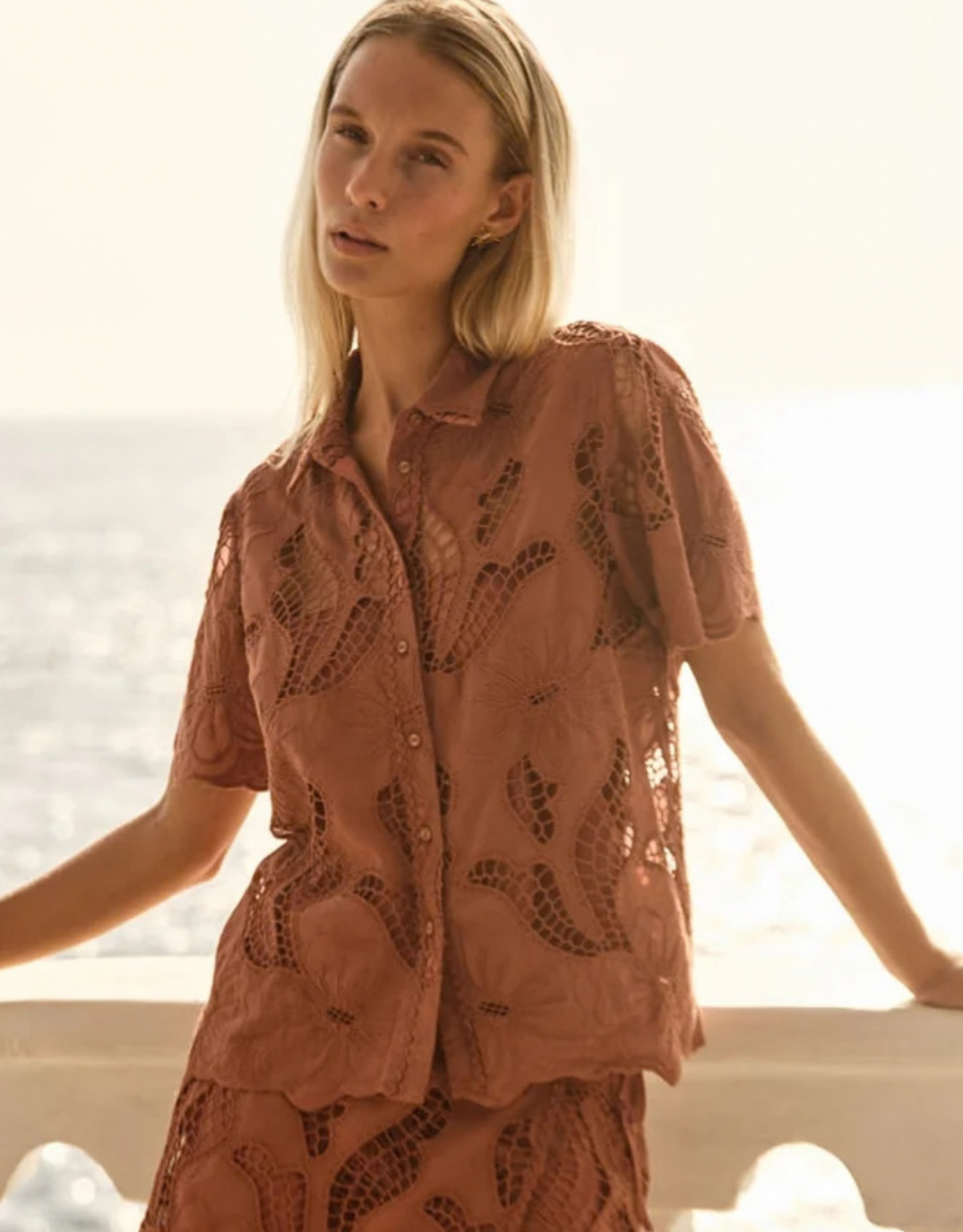Image of a model wearing Tops. Product name - Colette Lace Shirt Red Clay in Red Clay colour by brand - Fate and Becker