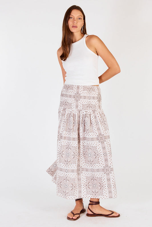 Image of a model wearing Skirts. Productname: Cowgirl Nudo Shirred Skirt Cream in Red colour by brand - Cowgirl Surfer