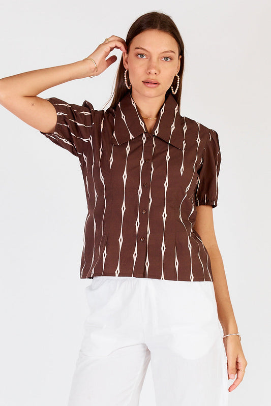 Image of a model wearing Tops. Productname: Cowgirl Surfer Taccia Top Chocolate in Chocolate colour by brand - Cowgirl Surfer